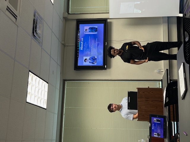 two people giving a presentation at LSU Cybersecurity Clinic